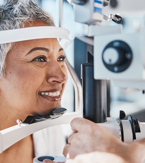 Smiling woman during an eye exam