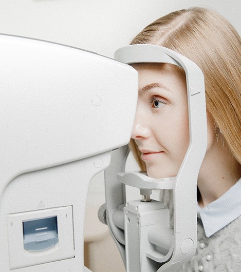 Young blonde woman having eye pressure tested