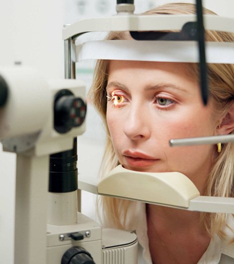 Female patient having light shined in eye