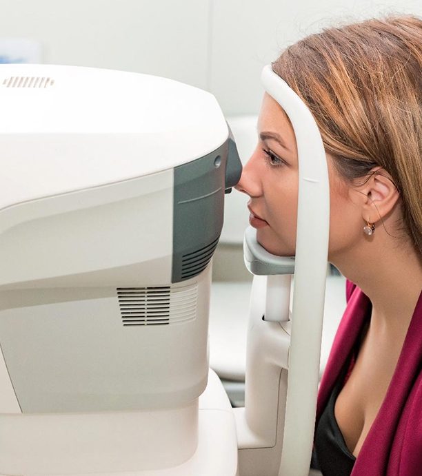 Woman taking off glasses and rubbing eyes