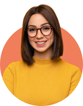 Young woman with glasses and yellow sweater smiling