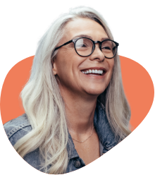 Smiling woman with glasses and long gray hair