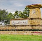 Yellow brick sign that reads Fieldstone