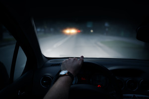 Driver’s view of a road and headlights at night